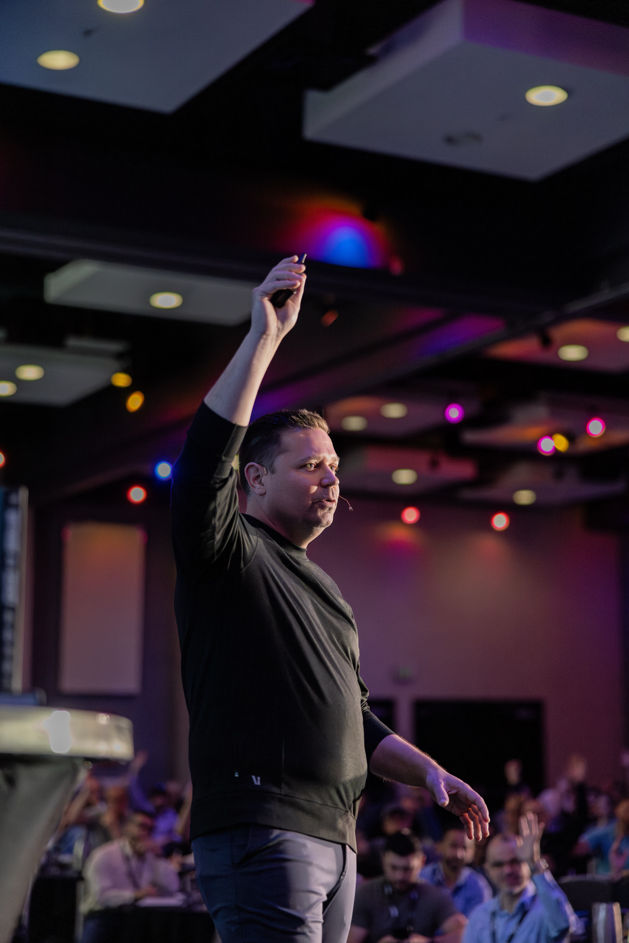 Tom Kelly speaking on stage